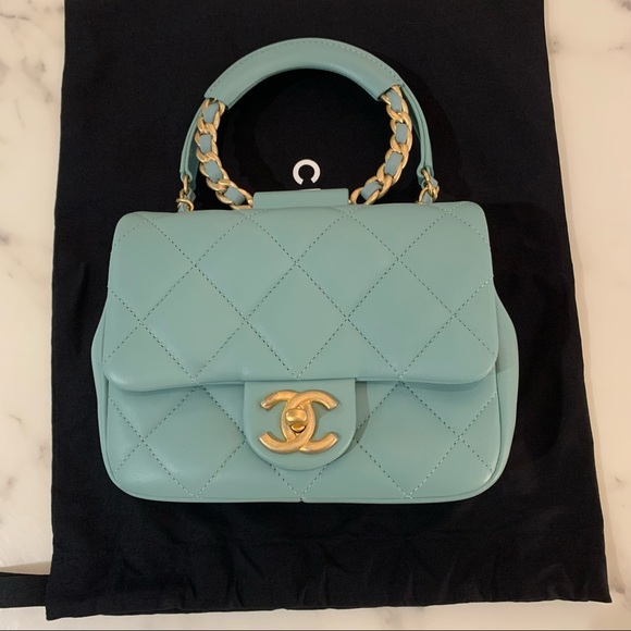 CHANEL Handbags - Chanel flap bag w/ top handle in lamb skin